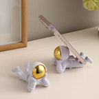 Decorative astronaut phone holder for desk and home décor