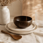 Coconut bowl with wooden spoon set for natural dining and table presentation