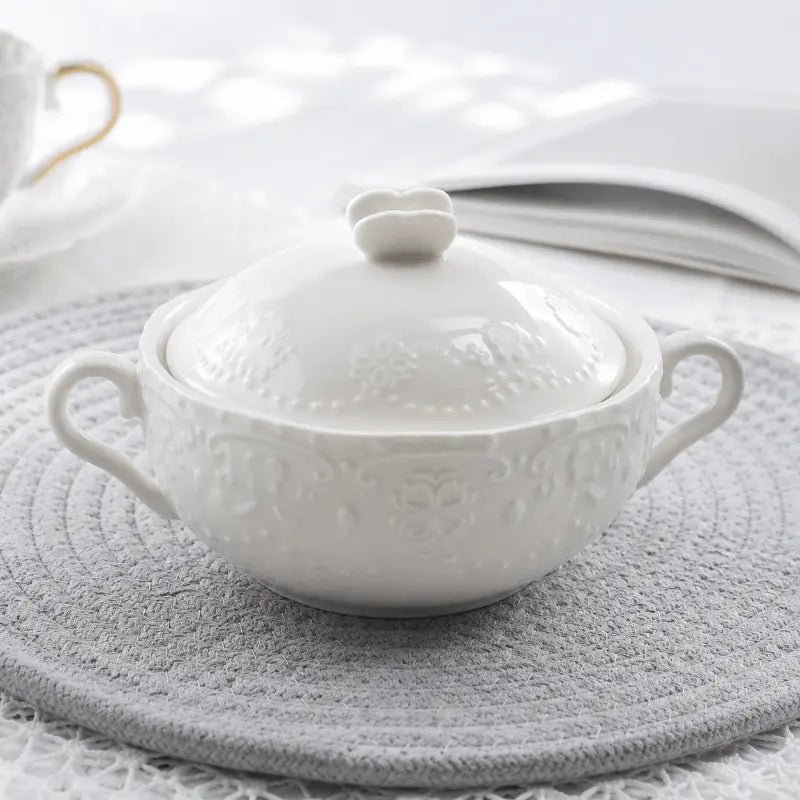 Embossed covered porcelain bowl for elegant dining and table presentation