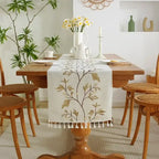 Embroidered cotton linen table runner with tassel details for dining table décor