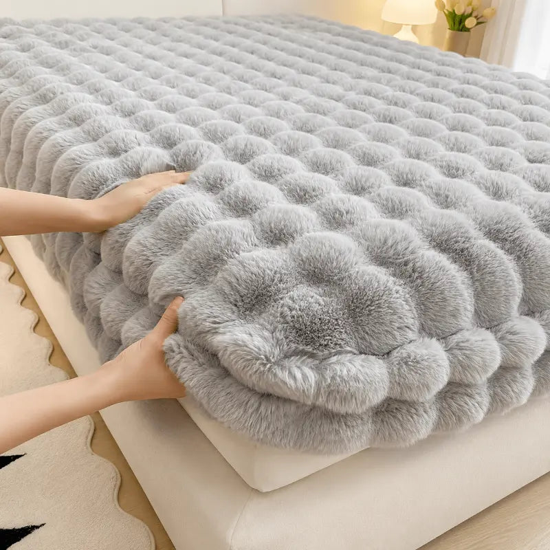 Fluffy plush fitted bed sheet for a warm and comfortable bedroom