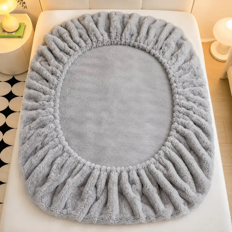 Fluffy plush fitted bed sheet for a warm and comfortable bedroom