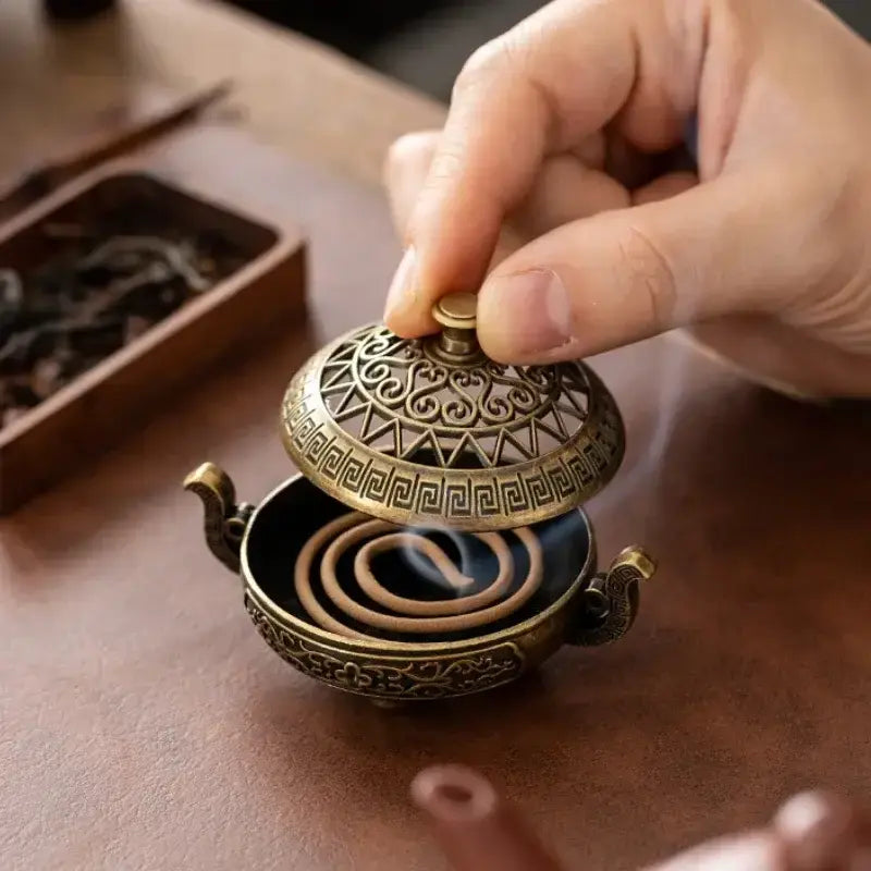 Vintage metal incense burner with decorative tripod design for home décor