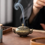 Vintage metal incense burner with decorative tripod design for home décor